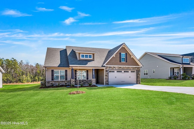 view of front of property with driveway, a garage, a shingled roof, stone siding, and a front yard