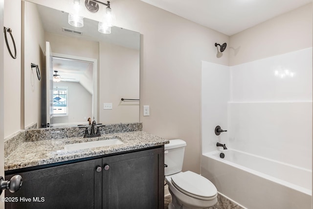 bathroom with toilet, visible vents, tub / shower combination, and vanity