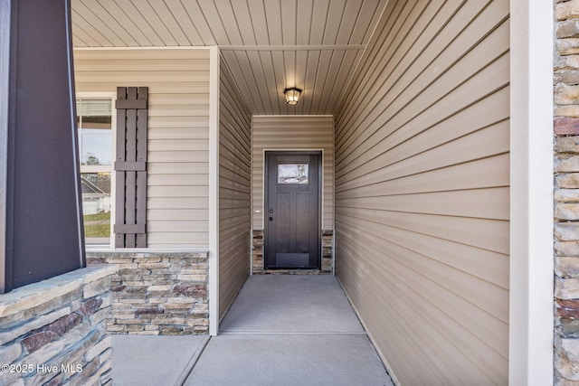 view of exterior entry with stone siding