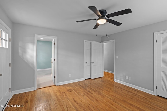 unfurnished bedroom featuring light hardwood / wood-style flooring and ceiling fan