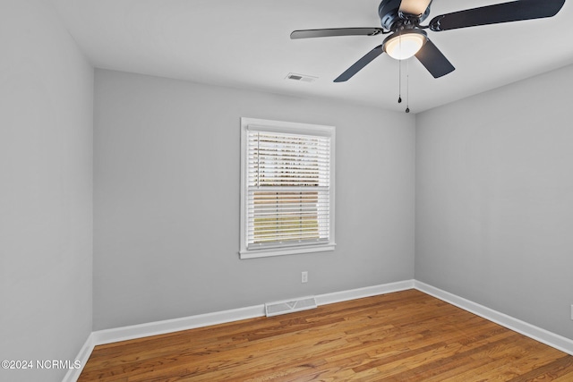 empty room with light hardwood / wood-style flooring and ceiling fan