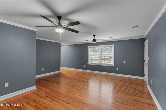 unfurnished room featuring ceiling fan, ornamental molding, and light wood-type flooring