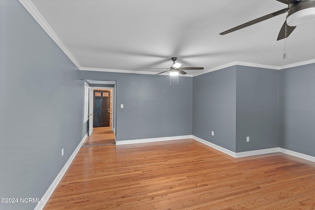 spare room featuring light hardwood / wood-style floors, ornamental molding, and ceiling fan