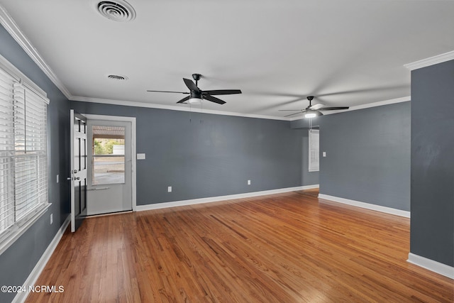 spare room featuring ornamental molding, hardwood / wood-style flooring, and ceiling fan