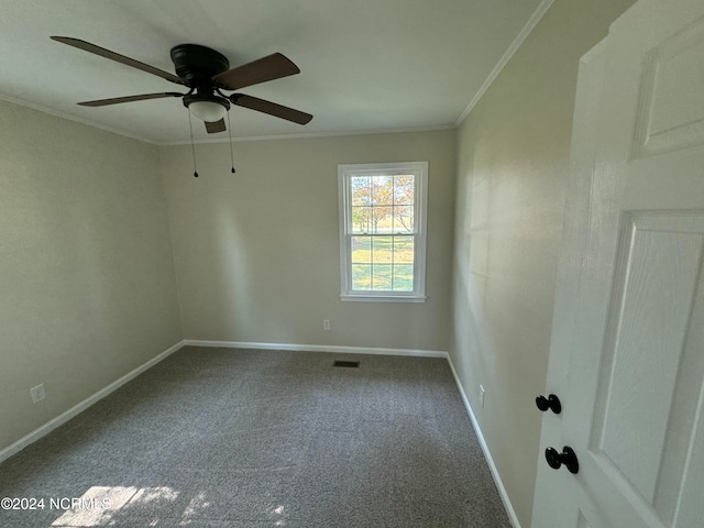 carpeted empty room featuring ceiling fan and ornamental molding