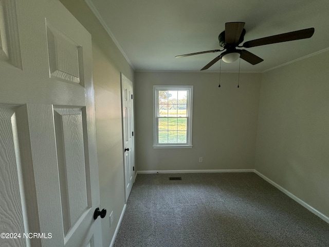 unfurnished room featuring crown molding, carpet flooring, and ceiling fan