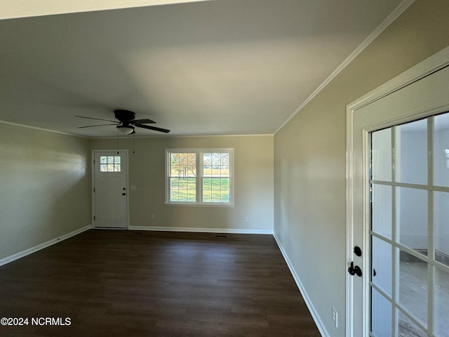 foyer entrance with crown molding, dark hardwood / wood-style flooring, and ceiling fan