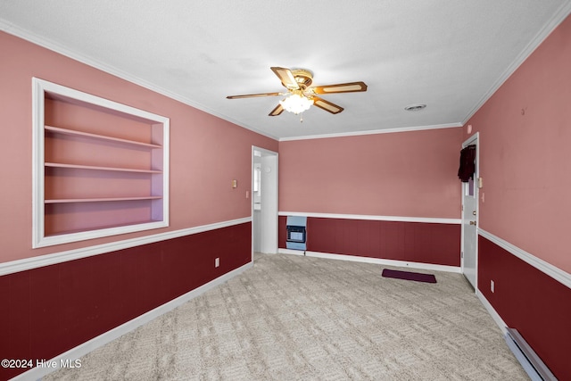 carpeted spare room featuring ornamental molding, a baseboard heating unit, a textured ceiling, and ceiling fan