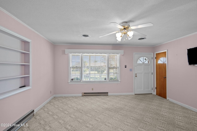 foyer featuring light colored carpet, a baseboard heating unit, a textured ceiling, and ceiling fan