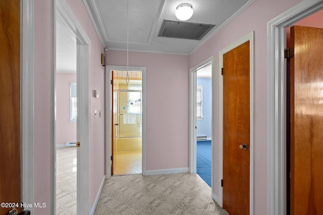 hallway with crown molding, a textured ceiling, baseboard heating, and light colored carpet