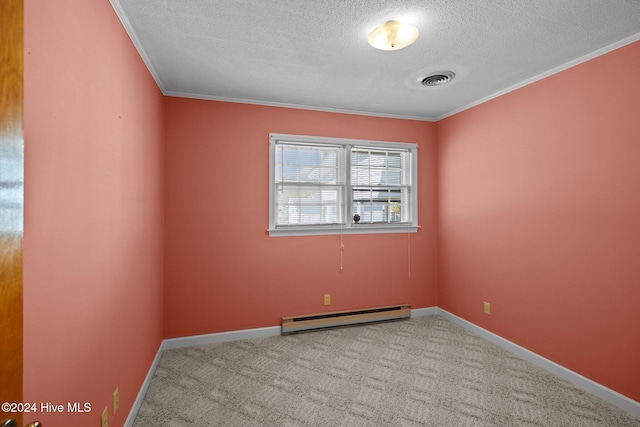 carpeted spare room with a textured ceiling, ornamental molding, and baseboard heating