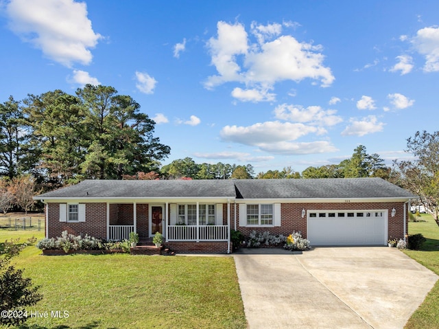 ranch-style house with a garage, a front lawn, and a porch