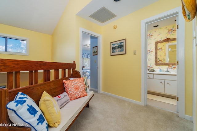 living area with visible vents, baseboards, plenty of natural light, and light colored carpet