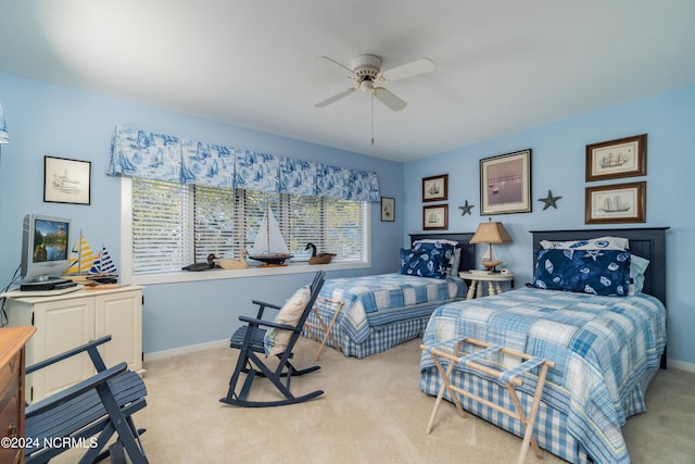 bedroom featuring ceiling fan and light colored carpet