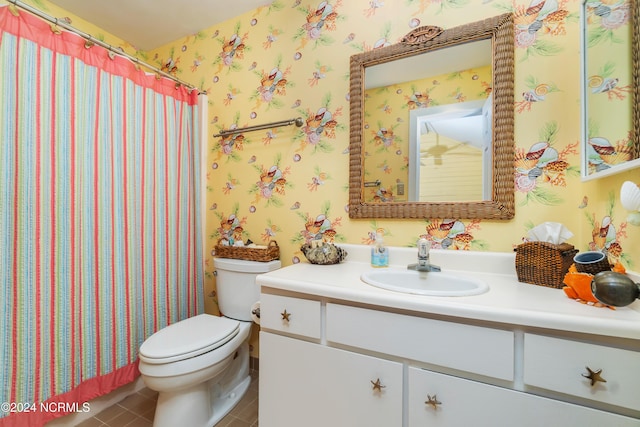 full bathroom with vanity, tile patterned floors, and toilet