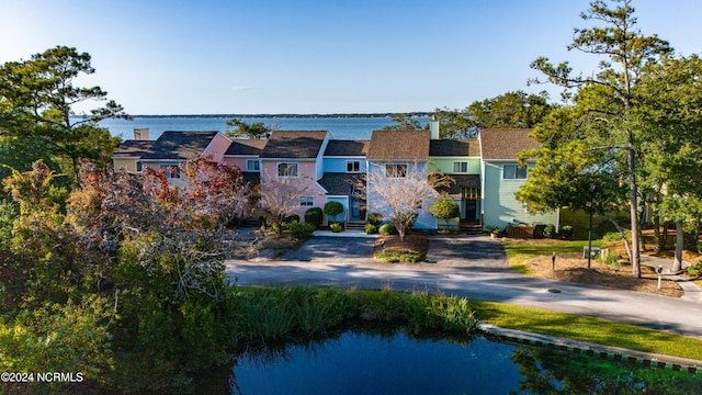 view of front of home featuring a water view