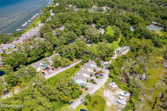 drone / aerial view featuring a residential view and a water view