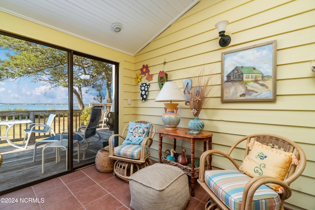 sunroom / solarium featuring wood ceiling and vaulted ceiling