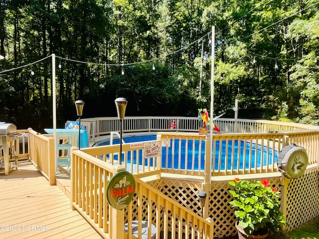 view of pool with a deck