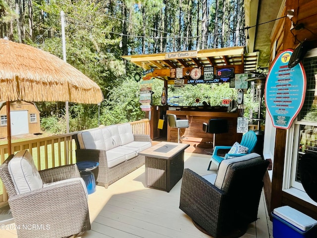 wooden terrace featuring an outdoor hangout area