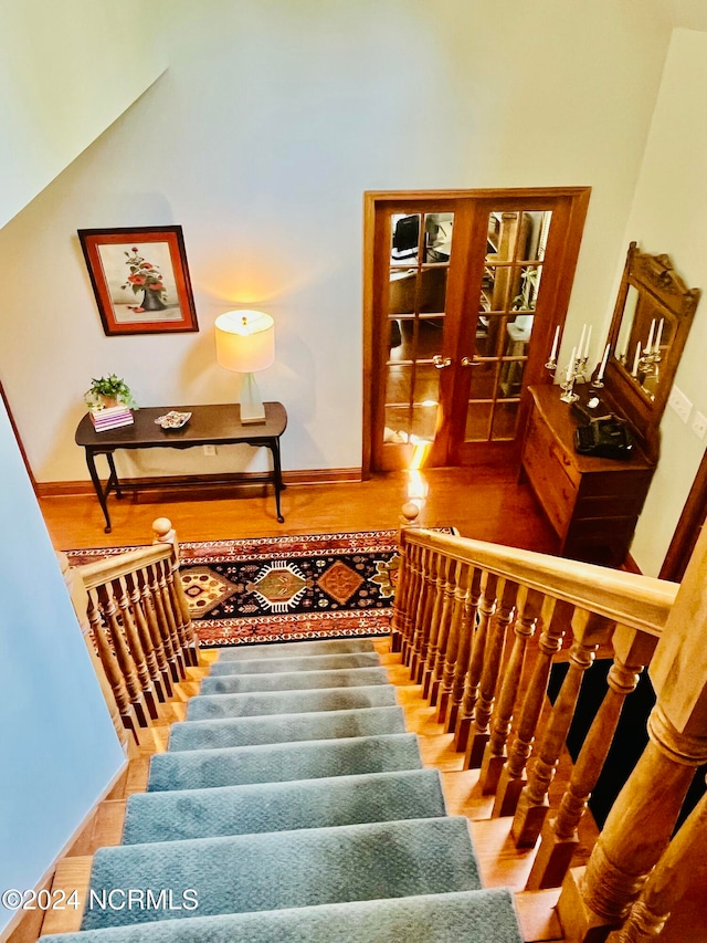 staircase featuring hardwood / wood-style flooring