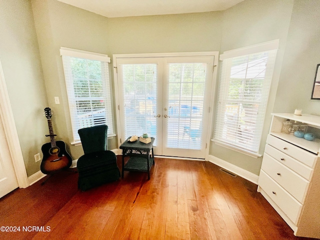 sitting room with french doors and dark hardwood / wood-style flooring