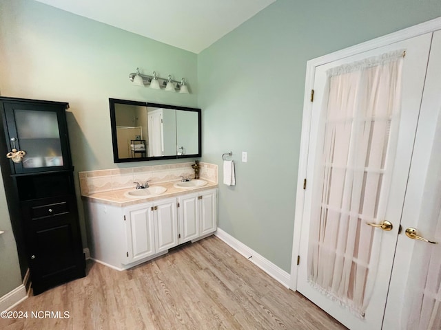 bathroom featuring vanity and hardwood / wood-style floors