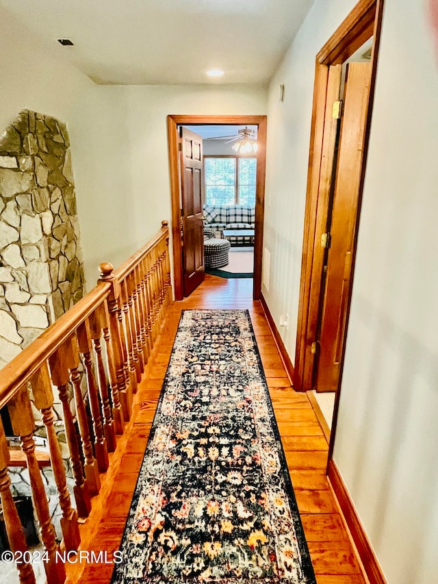 hall with light hardwood / wood-style flooring