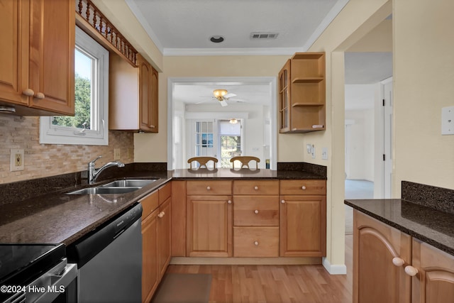 kitchen featuring a sink, visible vents, stainless steel dishwasher, open shelves, and dark stone countertops