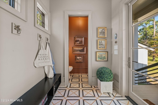 mudroom with light tile patterned flooring