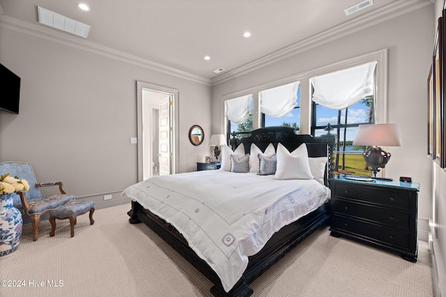 carpeted bedroom featuring ornamental molding