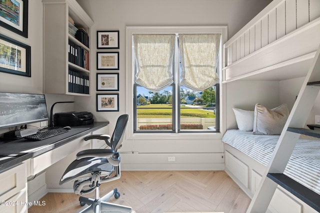 bedroom featuring light parquet floors and an inviting chandelier