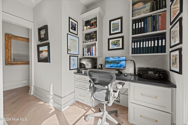 office area with light parquet floors