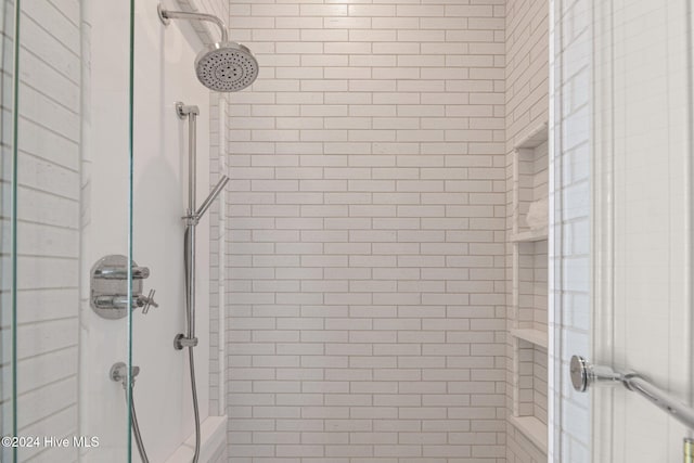 bathroom with a tile shower