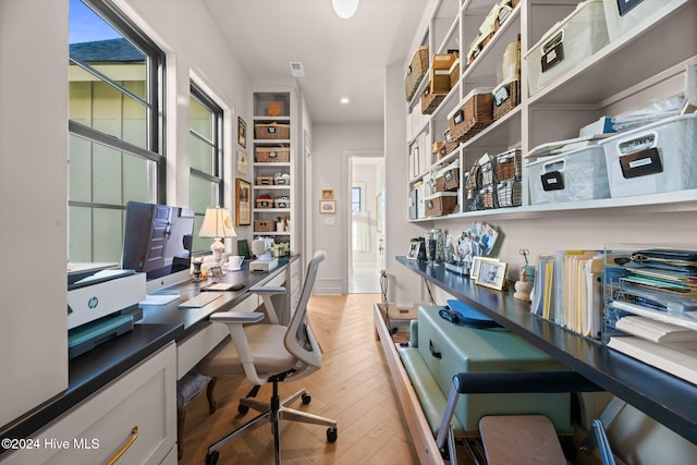 home office with hardwood / wood-style floors