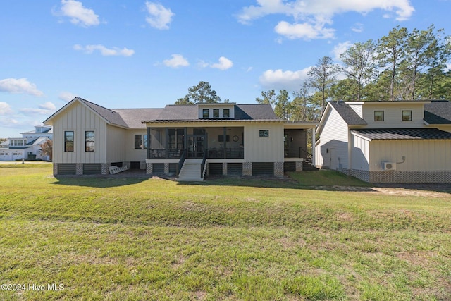 rear view of house with a lawn