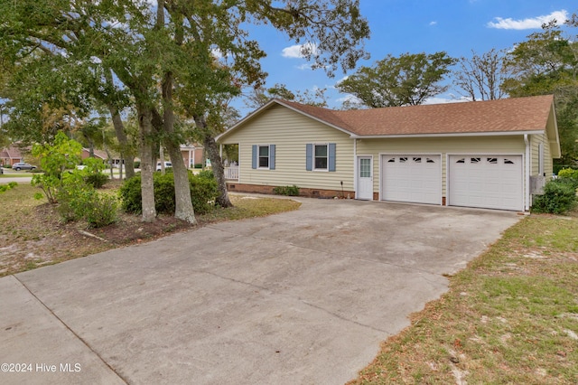 ranch-style house featuring a garage