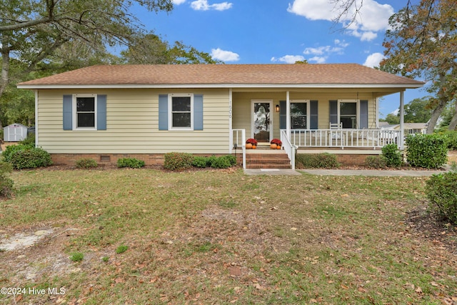 ranch-style house featuring a porch and a front yard