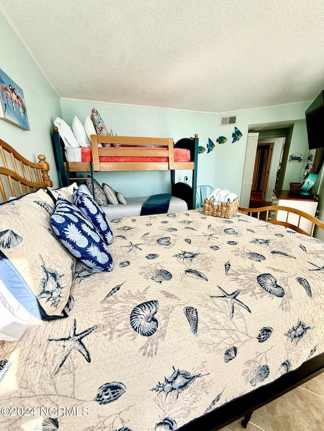 bedroom featuring a textured ceiling