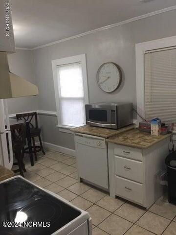 kitchen with white cabinetry, light tile patterned flooring, dishwasher, and stove