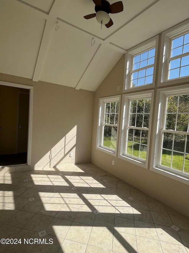 unfurnished sunroom with vaulted ceiling and ceiling fan