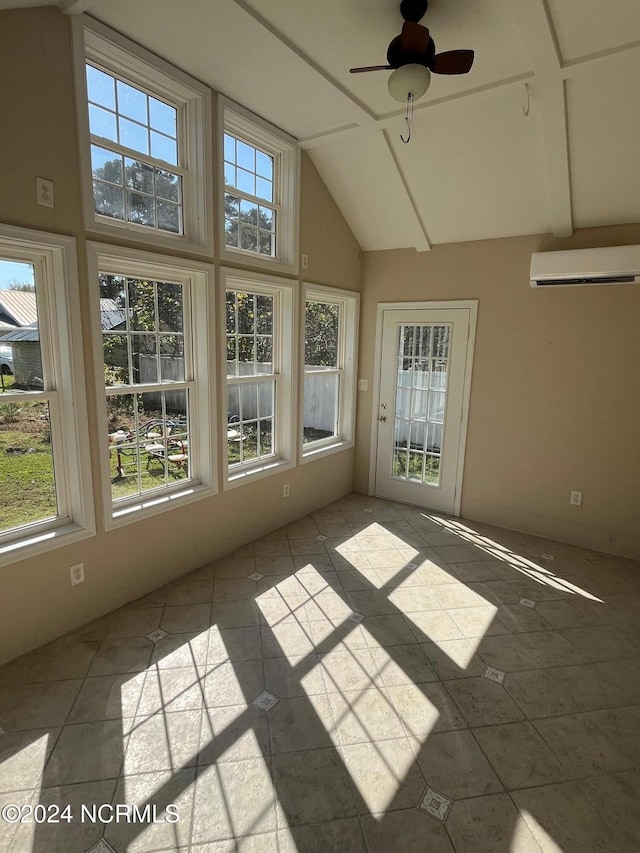 unfurnished sunroom featuring lofted ceiling, a wall mounted air conditioner, and ceiling fan