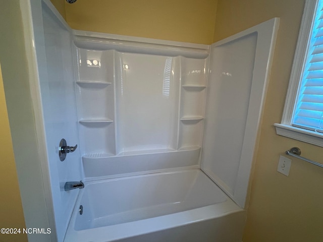 bathroom featuring washtub / shower combination