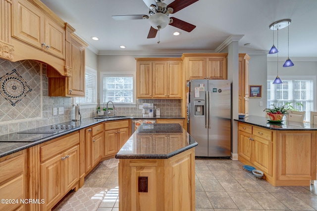 kitchen featuring sink, a kitchen island, stainless steel appliances, pendant lighting, and crown molding