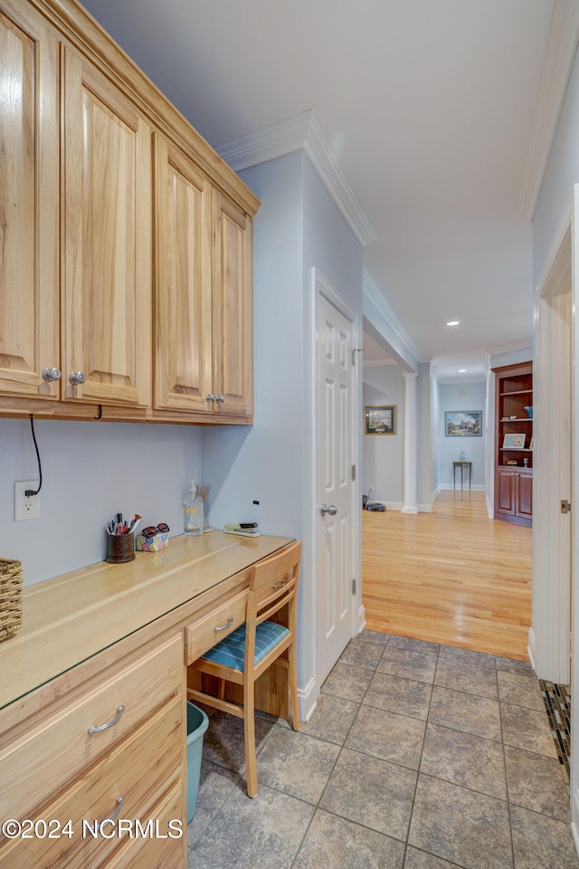 office space featuring ornamental molding and wood-type flooring