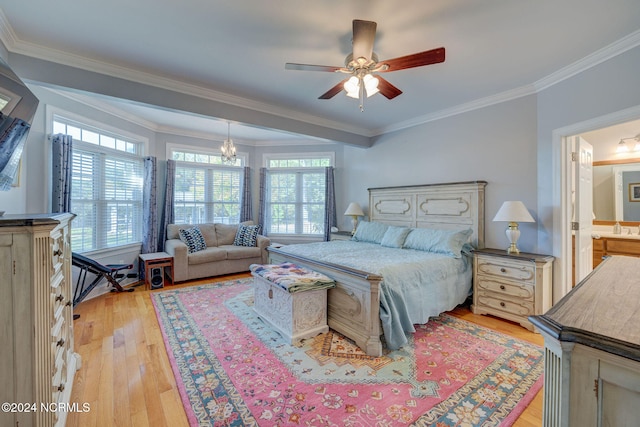 bedroom with ornamental molding, ensuite bathroom, multiple windows, and light wood-type flooring