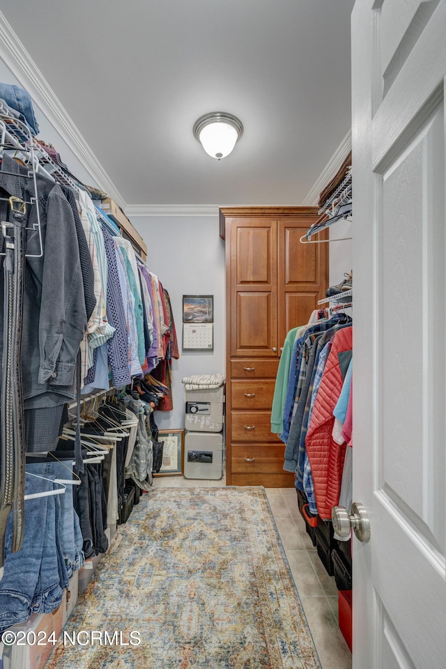 spacious closet with light tile patterned floors