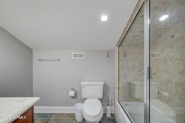 full bathroom featuring toilet, enclosed tub / shower combo, vanity, and tile patterned flooring