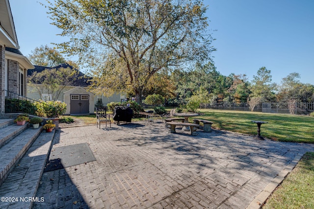 view of patio with a storage shed