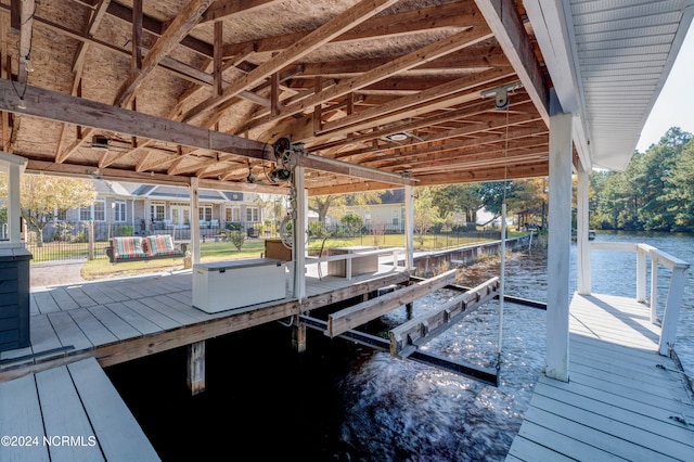 dock area with a water view